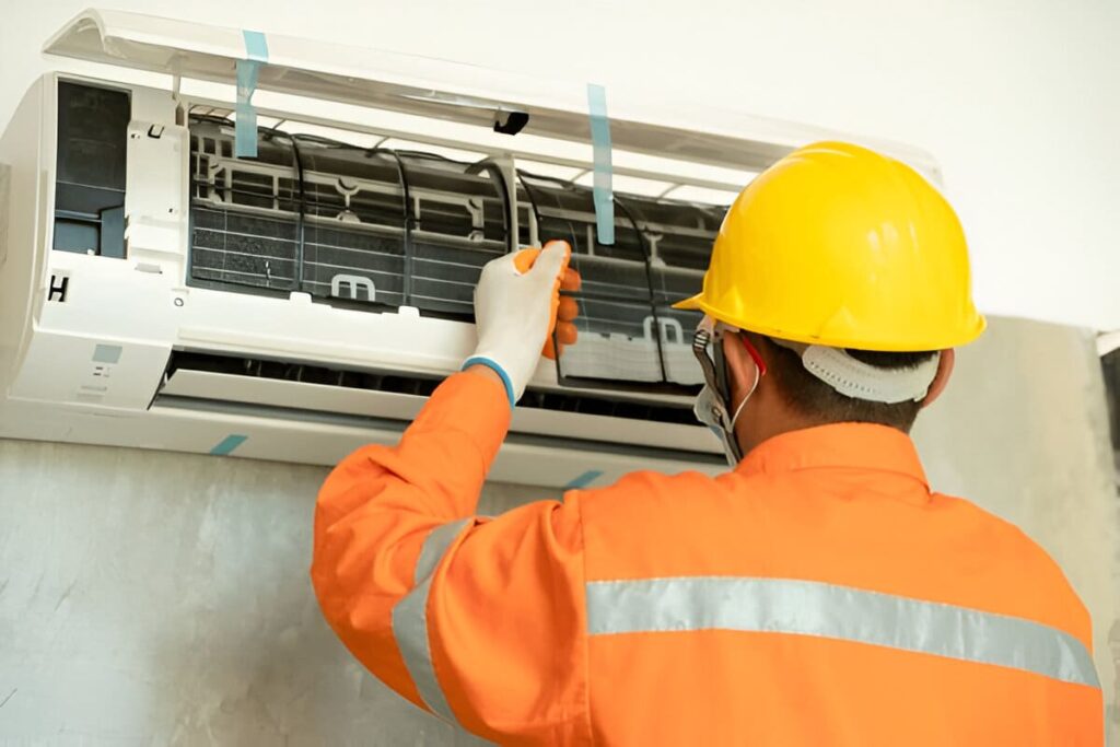 AC repair team replacing air conditioner coil in al barsha